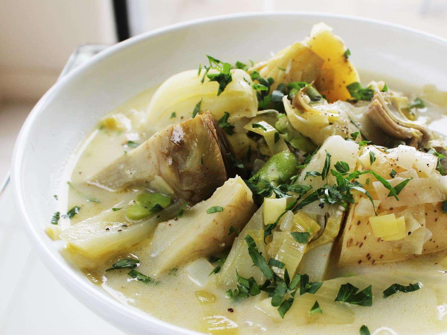 Braised Artichokes With Leeks and Peas From 'The New Vegetarian Cooking for Everyone' Image