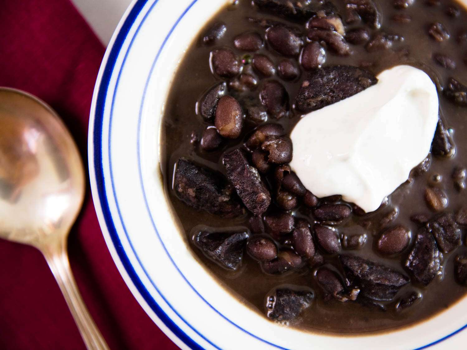Pressure Cooker Black Bean Soup With Sausage and Cumin-Lime Sour Cream Recipe Image