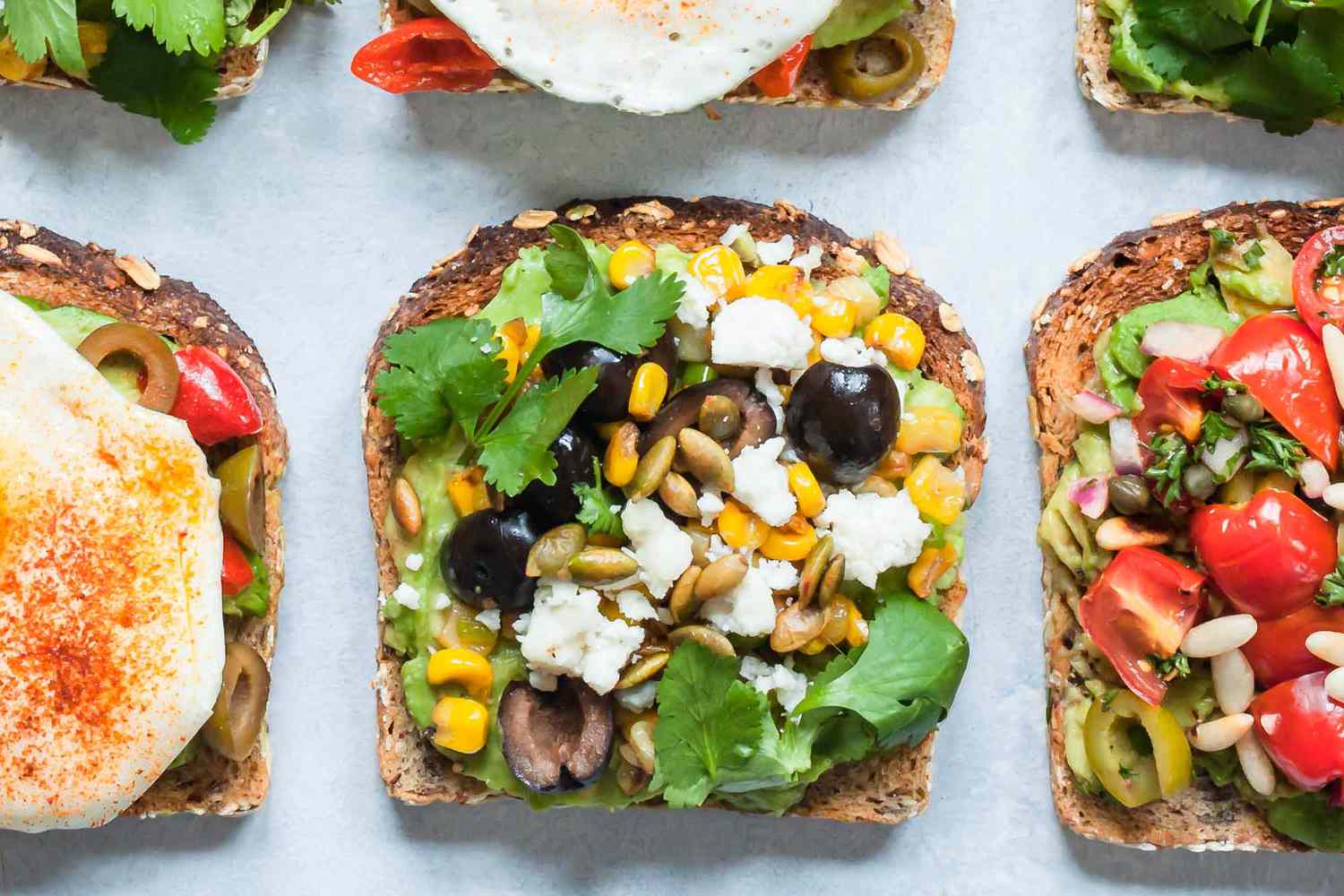 Avocado Toasts with Corn, Olives &amp; Queso Fresco Recipe Image