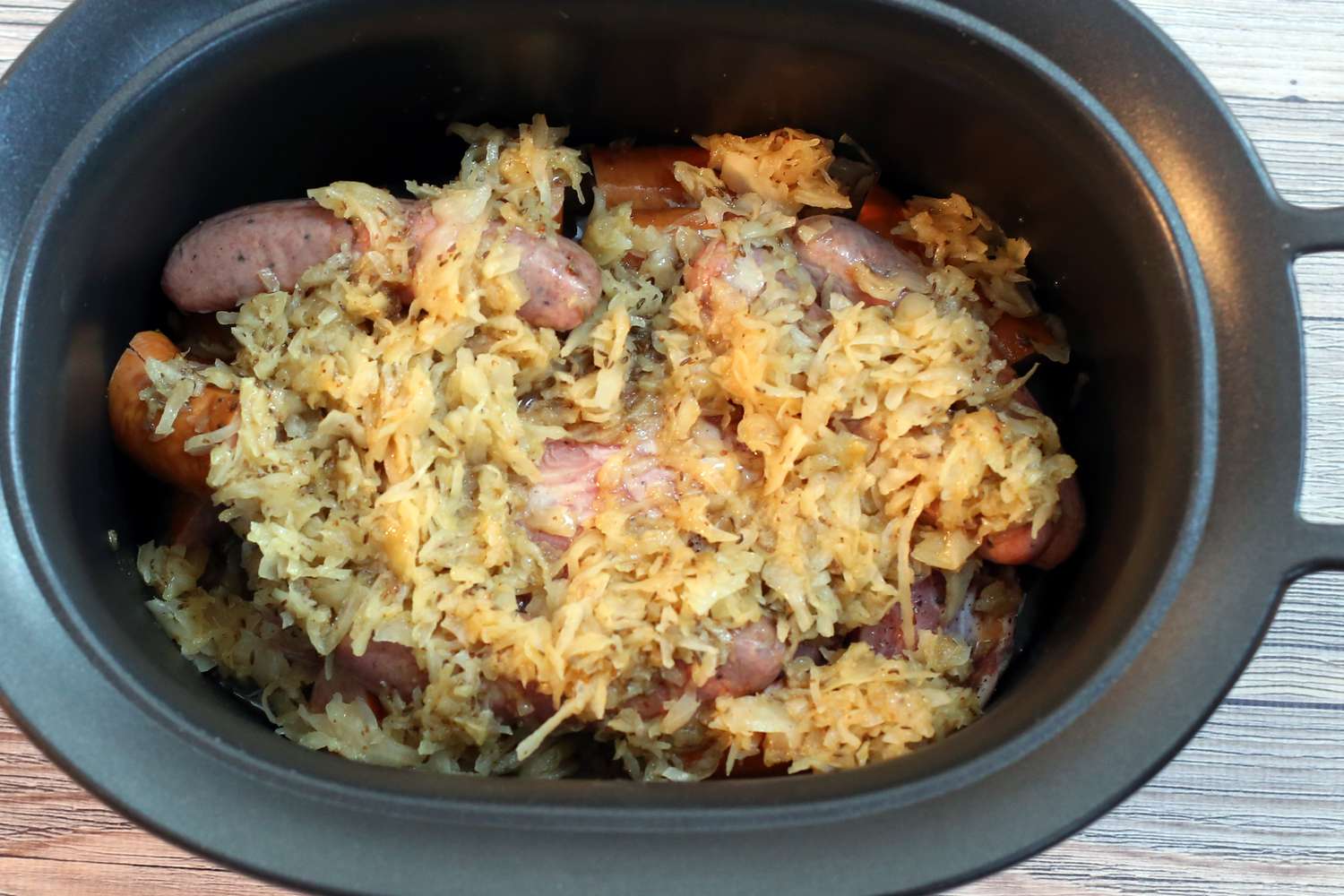 Slow Cooker Pork, Sauerkraut, and Sausage Recipe Image